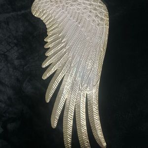 Metal angel wing wall decor. Beautiful year-round, but especially for Christmas.
